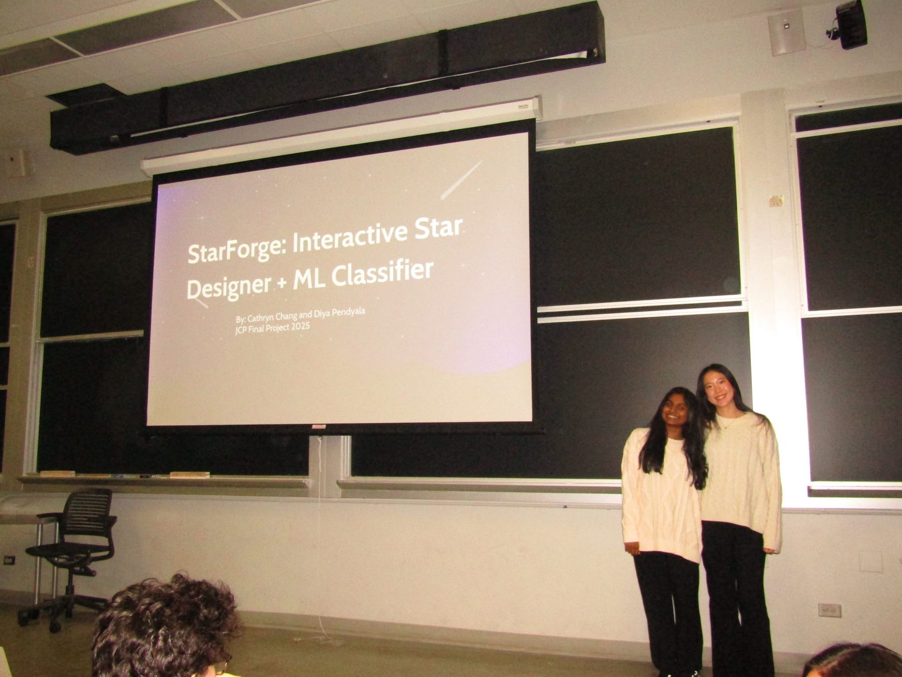 Diya and Cathryn presenting their Fall 2025 Junior Consultant Program final project